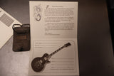 Gibson 25/50 Anniversary Belt buckle with papers